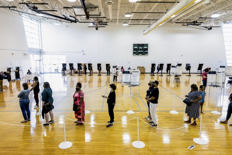 Image: Voters wait to cast their ballots for the Washington, D.C. primary elections on June 21, 2022.