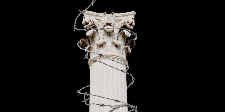 Photo Illustration: A Supreme Court pillar wrapped in barbed wire