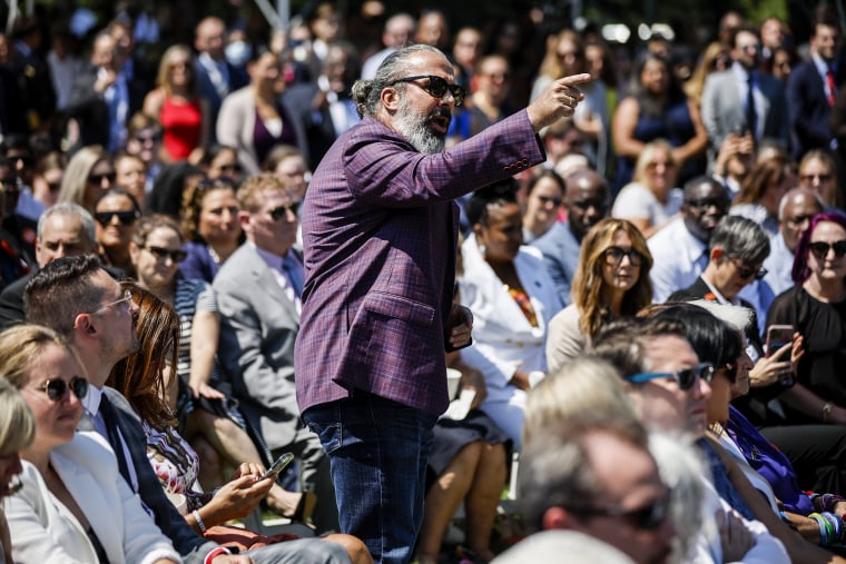 Manuel Oliver, whose son Joaquin was killed in the Parkland mass shooting, interrupts President Joe Biden as he speaks about Safer Communities Act on the South Lawn of the White House on July 11, 2022.