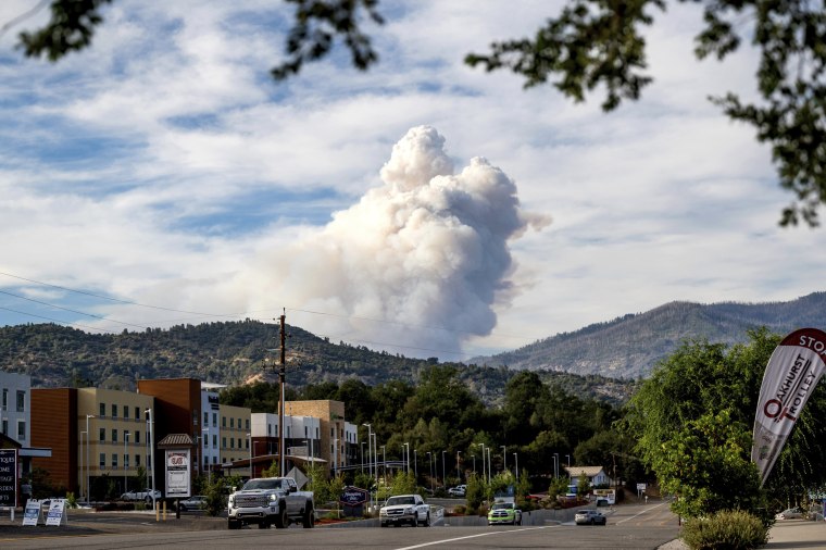 Image: Viewed from Oakhurst in Madera County, Calif., a plume rises from the Washburn Fire burning in Yosemite National Park on July 8, 2022.