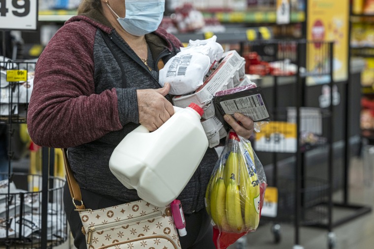 A shopper holds groceries while waiting to checkout inside a grocery store in San Francisco, California, U.S., on Monday, May 2, 2022. U.S. inflation-adjusted consumer spending rose in March despite intense price pressures, indicating households still have solid appetites and wherewithal for shopping.