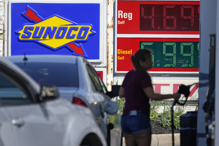 A woman pumps gas at a Sunoco mini-mart in Independence, Ohio, on July 12, 2022