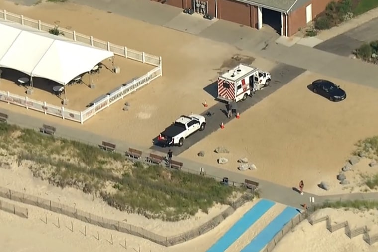 Swimming was suspended at Smith Point Beach on Wednesday morning for a second time this month after a shark bit a surfer.