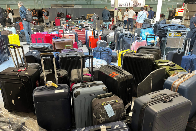 Suitcases sit uncollected at Heathrow Airport