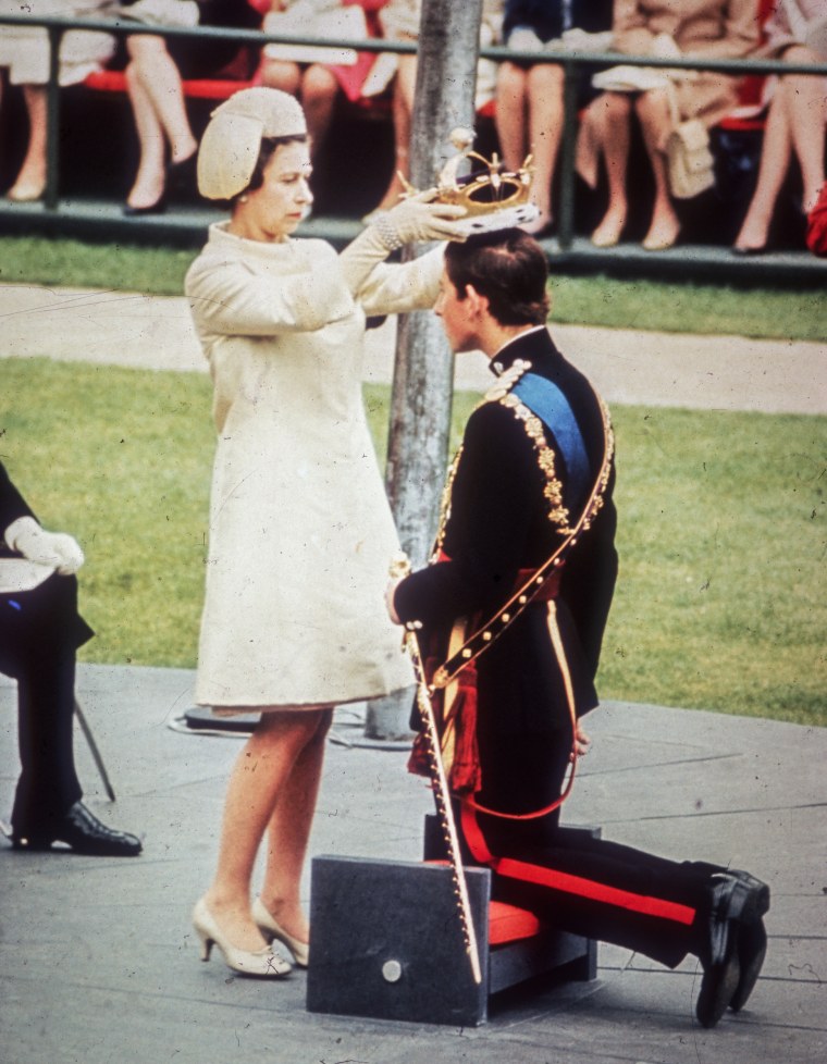Queen Elizabeth II crowns her son Charles, Prince of Wales, during his investiture ceremony at Caernarvon Castle in Wales on July 1, 1969.