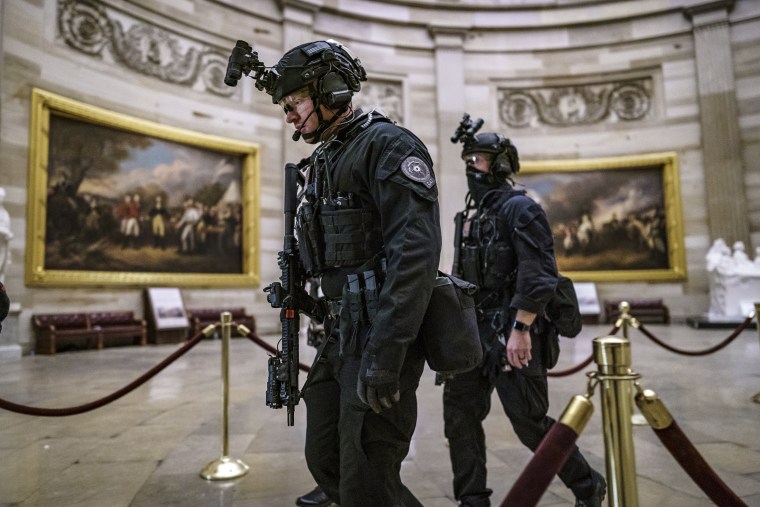 Members of the U.S. Secret Service Counter Assault Team walk through the Rotunda as they and other federal police forces responded as violent protesters loyal to President Donald Trump stormed the U.S. Capitol on Jan. 6, 2021.