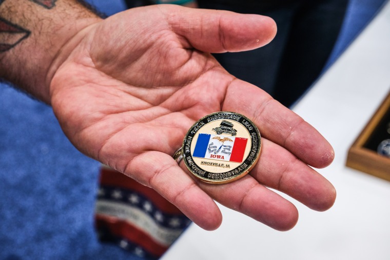 Michael Braman shows off his challenge coin at the VFW Convention in Kansas City, Mo., on July 16, 2022.