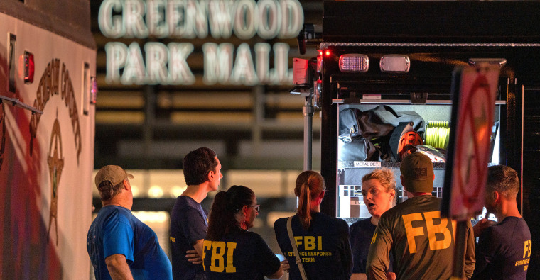 Image: FBI agents gathered outside the Greenwood Park Mall.