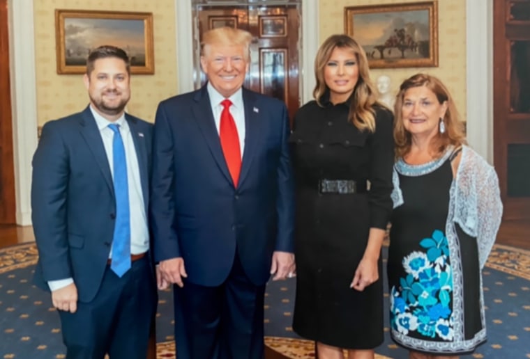 Brett Eagleson, son of Sept. 11 victim Bruce Eagleson, with President Donald Trump and first lady Melania Trump.