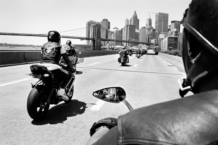 Members of a Black outlaw motorcycle club ride down the FDR Drive in New York. "Ezy Ryders," a photography book by Cate Dingley, documents New York's Black motorcycle clubs.