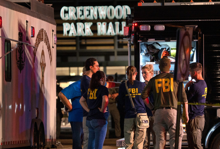 Image: FBI agents gather outside Greenwood Park Mall in Greenwood, Ind., after a shooting on July 17, 2022.