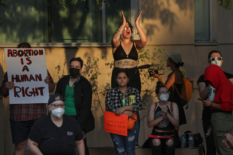 Image: Abortion rights protesters chant during a pro-choice rally at the Federal Courthouse in Tucson, Ariz., on July 4, 2022.