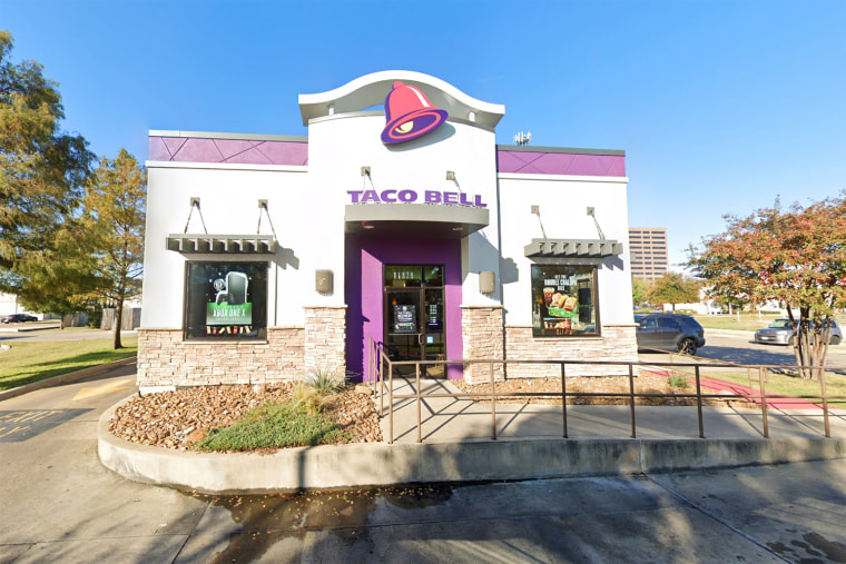 The video appears to show a Taco Bell worker pouring scalding water on customers