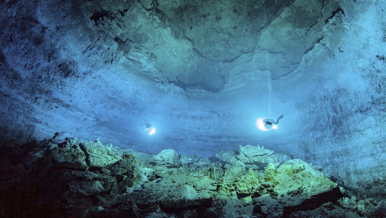 Image: National Institute of Anthropology and History scuba divers explore the Hoyo Negro underwater cave, or cenote, in Tulum, Mexico, in an undated photo.