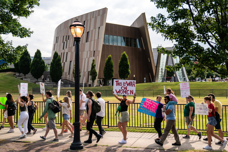 Image: Protesters march past the National Center for Civil and Human Rights during a protest against the Supreme Court's ruling in the Dobbs v Jackson Women's Health Organization on June 25, 2022 in Atlanta.