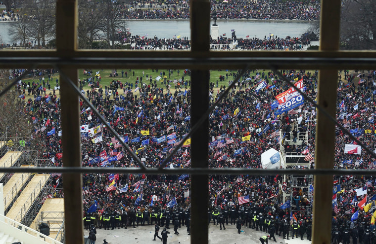 Rioters gather outside the Capitol's Rotunda