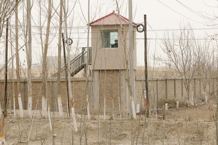 A security official watches from a guard tower at a detention facility in the Chinese region of Xinjiang last year. 