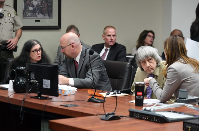 Image: Louise and Daivd Turpin speak with their attorneys in court for their sentencing in Riverside, California on April 19, 2019.