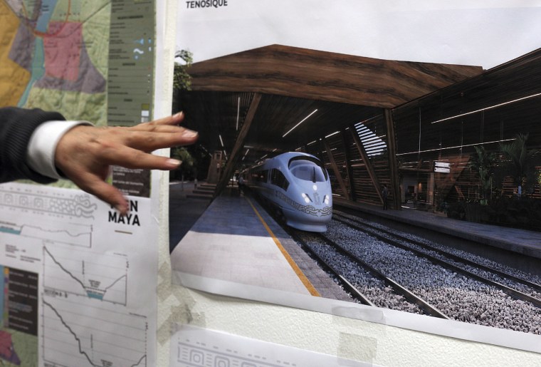 Image: Rogelio Jiménez Pons, director of Fonatur, points to photos of a planned train through the Yucatan Peninsula on March 18, 2019, in Mexico City.
