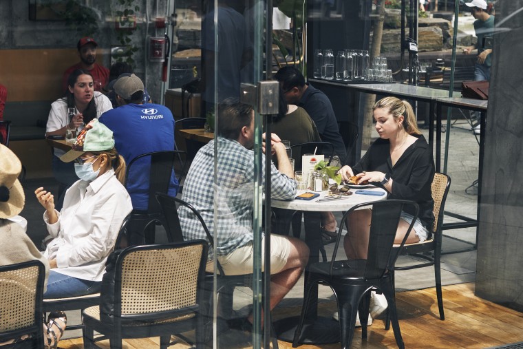 Diners eat at a restaurant