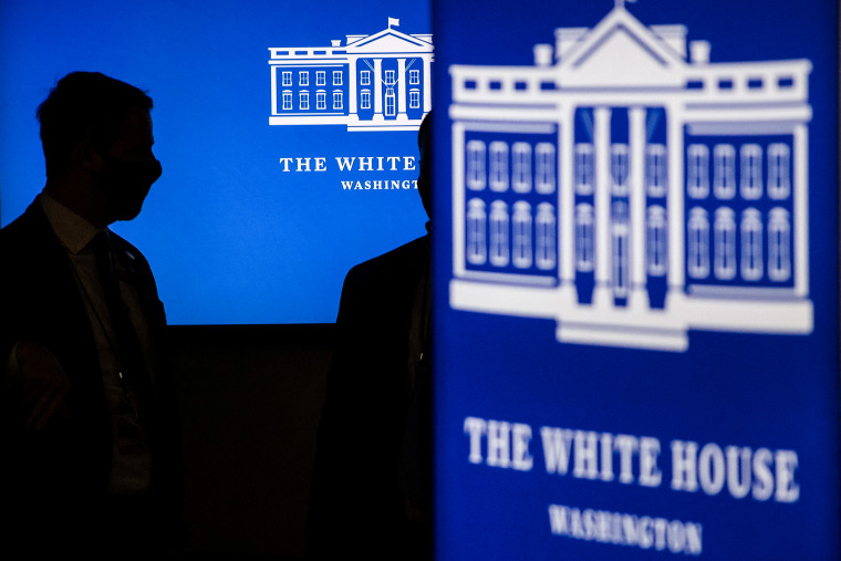 Secret service agents stand near screens before President Joe Biden met virtually with independent farmers and ranches from the White House on Jan. 3, 2022.