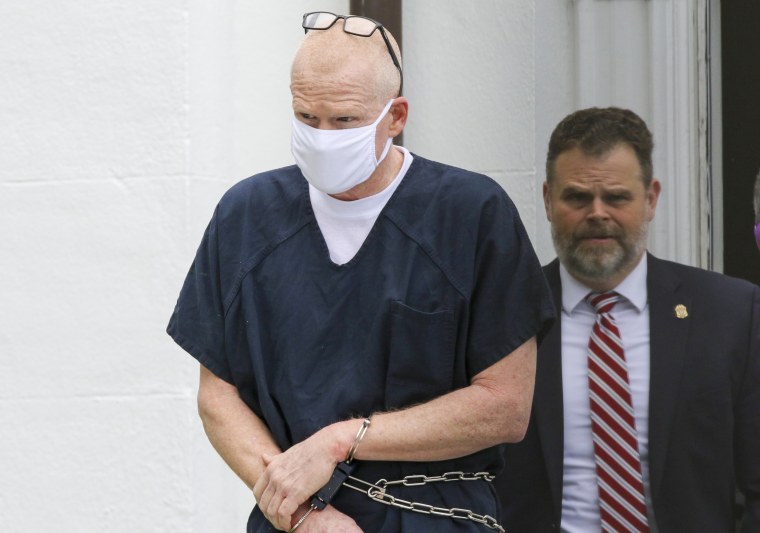 Image: Alex Murdaugh is escorted out of the Collation County Courthouse in Walterboro, S.C., on July 20, 2022.