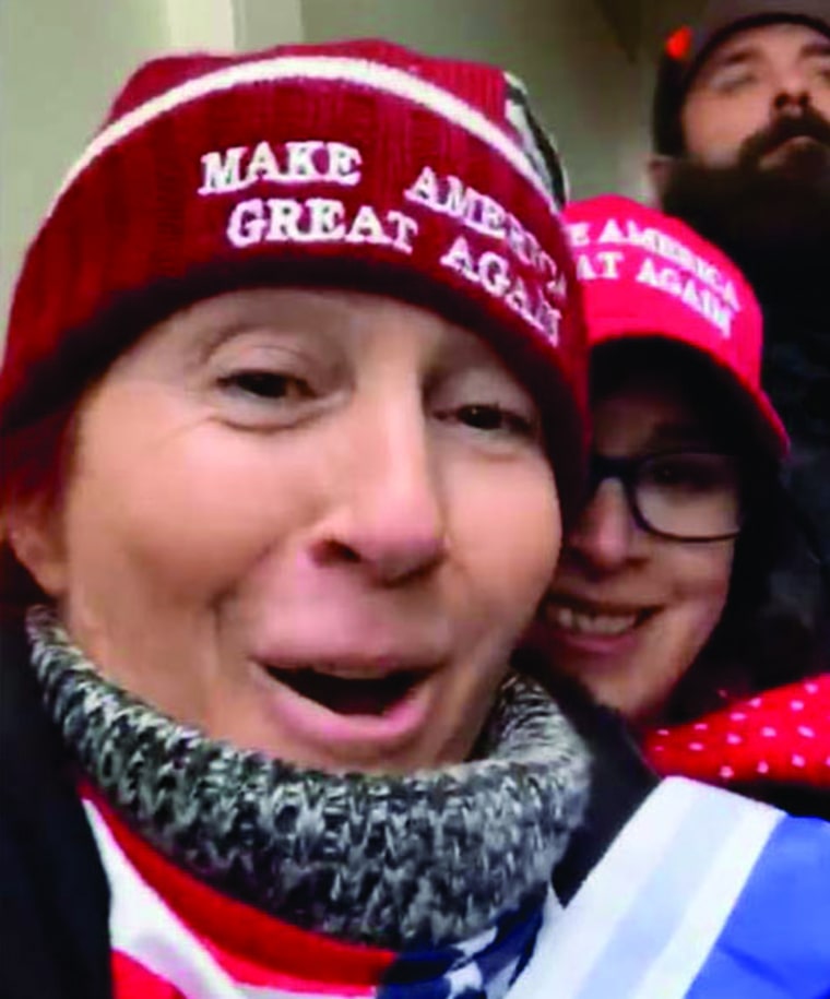 A video screenshot shows both Dawn Bancroft wearing a red "Make America Great Again" ski-cap style hat, and Diana Santos-Smith wearing a red "Make America Great Again" baseball hat during the U.S. Capitol riots on Jan. 6, according to the FBI. 