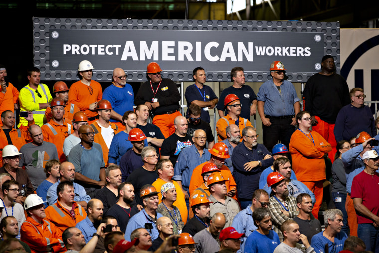 Inside: Audience members listen as then-President Donald Trump speaks at the U.S. Steel Corp. Granite City Works facility in Granite City, Ill., on July 26, 2018.