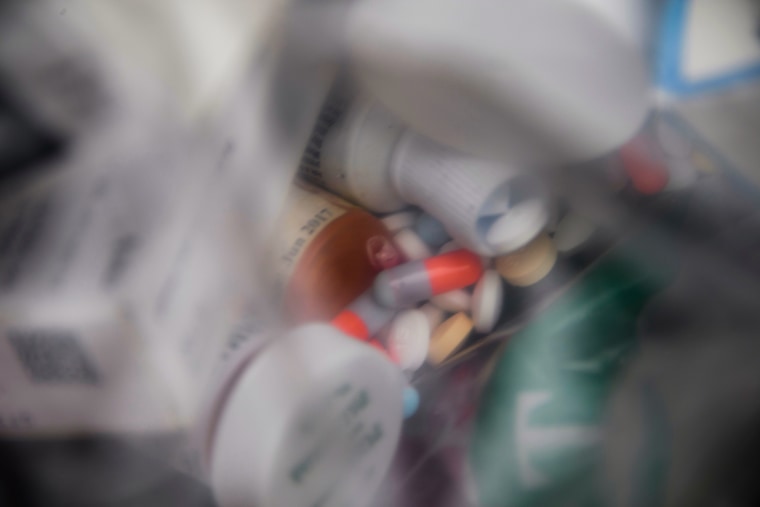 A plastic bag of assorted pills and prescription drugs dropped off for disposal sits in a container during the Drug Enforcement Administration (DEA) 20th National Prescription Drug Take Back Day at Watts Healthcare, on April 24, 2021, in Los Angeles.