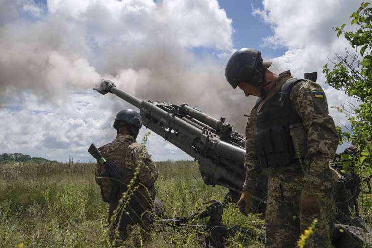 Soldiers with a Ukrainian battalion fire at Russian positions with U.S.-supplied weapons in Kharkiv on July 14.
