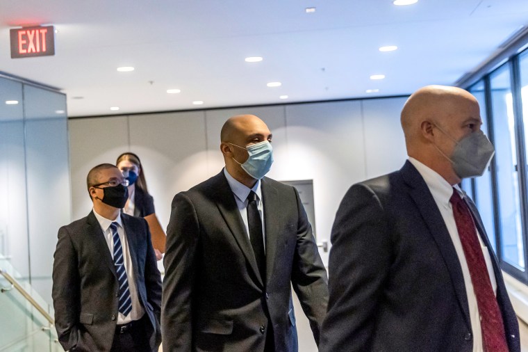 Former Minneapolis Police Officers Tou Thao, left, and J. Alexander Kueng, center, along with his attorney leave the US District Court in St. Paul, Minn., on Jan. 11, 2022.