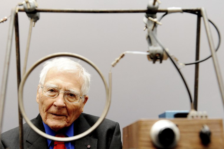 Scientist and inventor James Lovelock, then 94, with one of his early inventions, a homemade gas chromatography device used for measuring gas and molecules in the atmosphere.