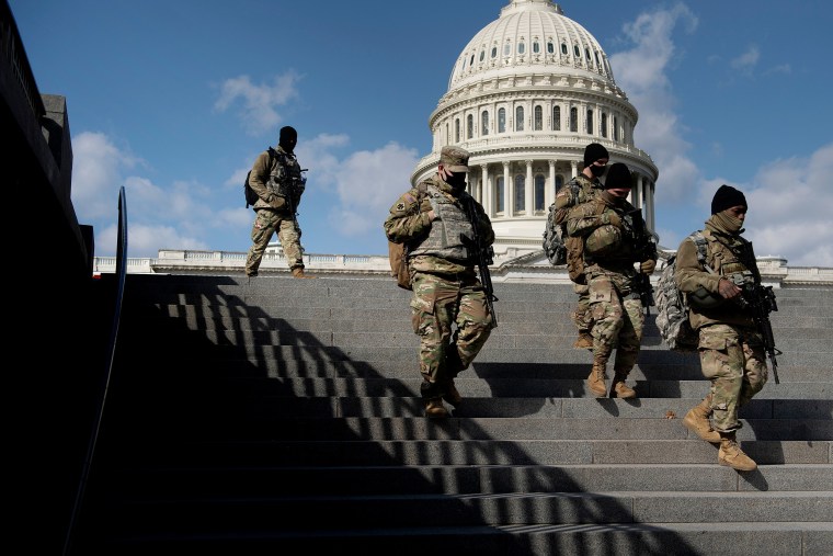 Members of the National Guard patrol the grounds of the US Capitol on March 4, 2021, in Washington, D.C.