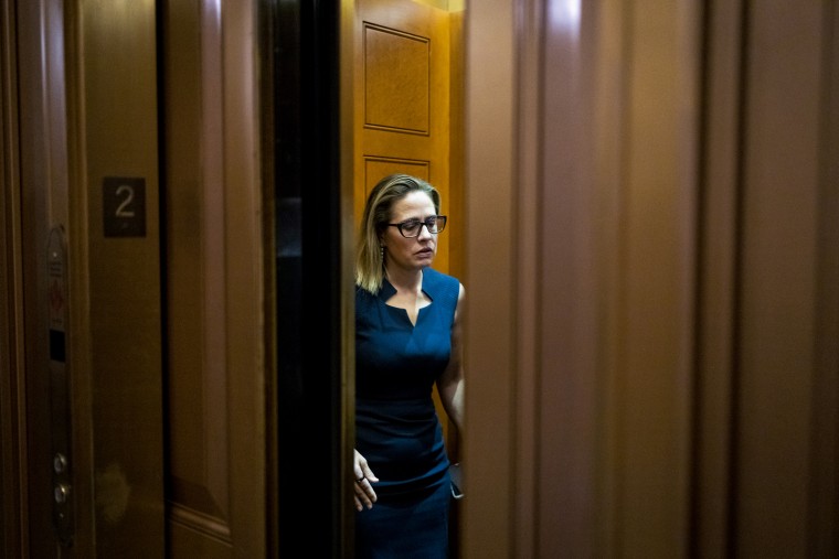 Sen. Kyrsten Sinema, D-Ariz., in an elevator outside the Senate Chamber at the Capitol on April 7, 2022, in Washington, D.C.