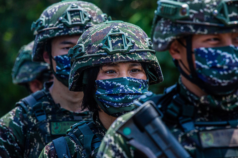 Taiwanese military personnel stand in a line during the Han Kuang military exercise, which simulates China's People's Liberation Army nvading the island, on July 27, 2022 in New Taipei City, Taiwan.