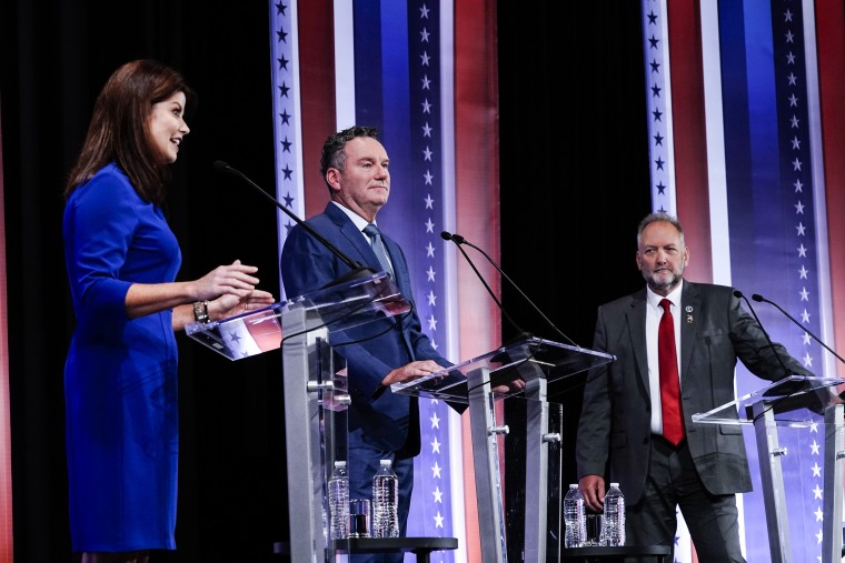 Rebecca Kleefisch, Tim Michels, center, and Timothy Ramthun participate in a televised Wisconsin Republican gubernatorial debate on July 24, 2022, in Milwaukee.