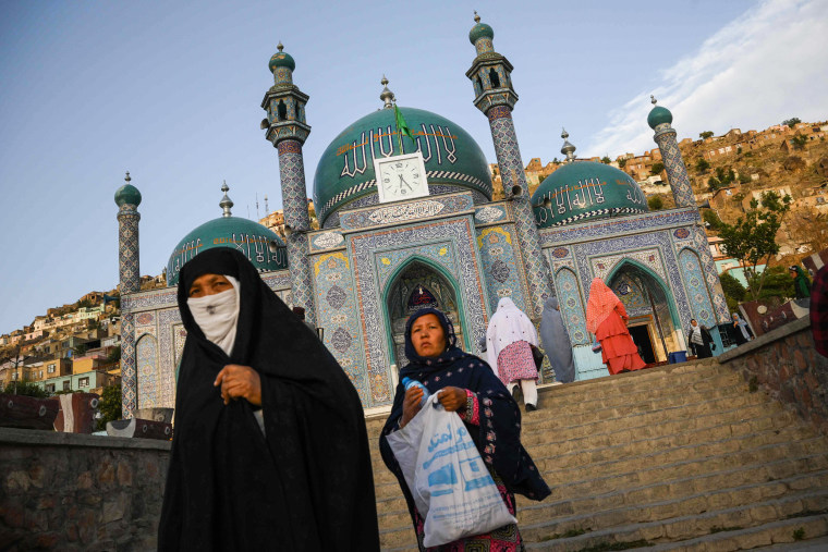 Women from the Shi'ite community leave the Sakhi Shah-e Mardan Shrine and mosque in Kabul on july 24, 2022.