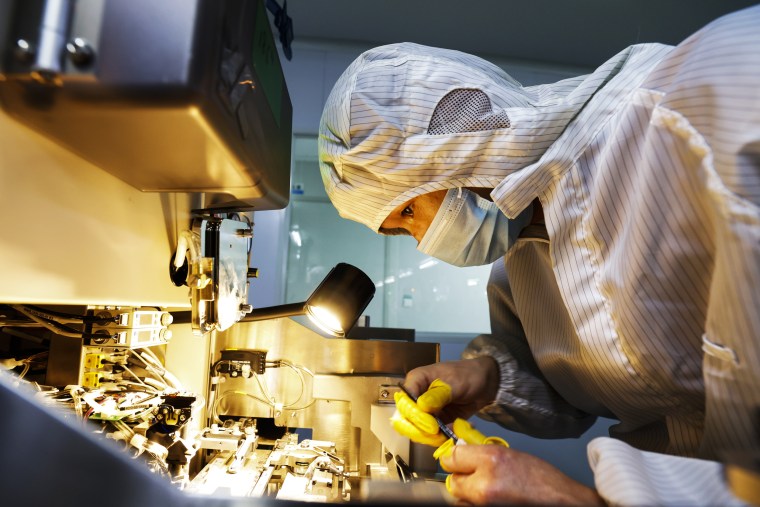 Image: An employee works at a chip manufacturing company on April 19, 2022 in Suqian, Jiangsu Province of China.