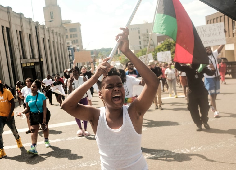 Demonstrators gather outside Akron City Hall to protest the police killing