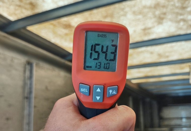 A temperature reading taken by a driver in the cargo area of ​​a UPS delivery truck on a mid July afternoon in Florida. 
