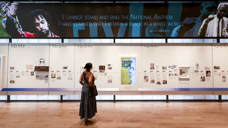 Image: A visitor look at a display inside the new Jackie Robinson Museum on July 26, 2022 in New York.
