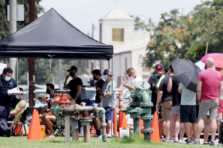 Image: People line up get vaccinated against the monkeypox virus on July 21, 2022, at Ted Watkins Park in Los Angeles.