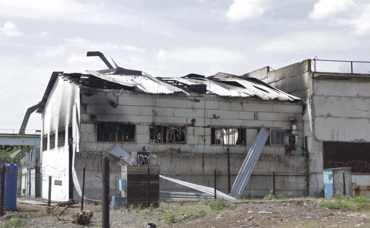 A destroyed barrack at a prison damaged in a rocket attack