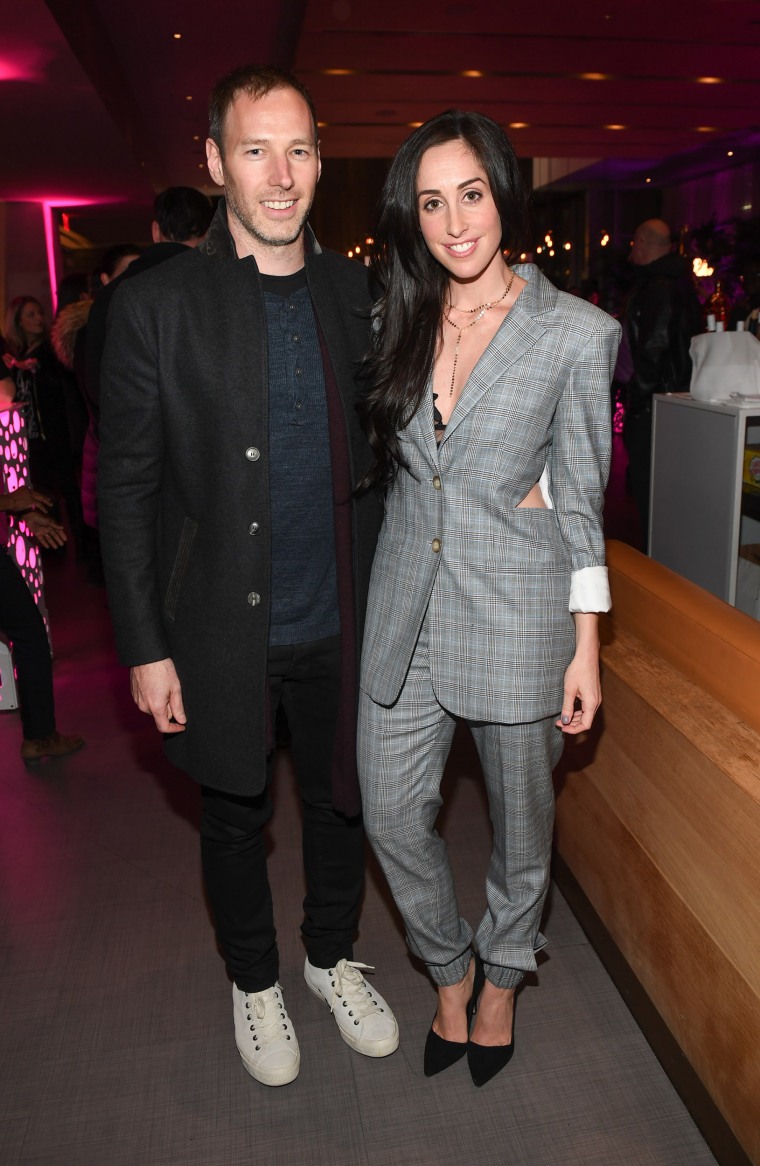 Catherine Reitman and Philip Sternberg (in 2018) are married in "Workin Moms" and in real life.