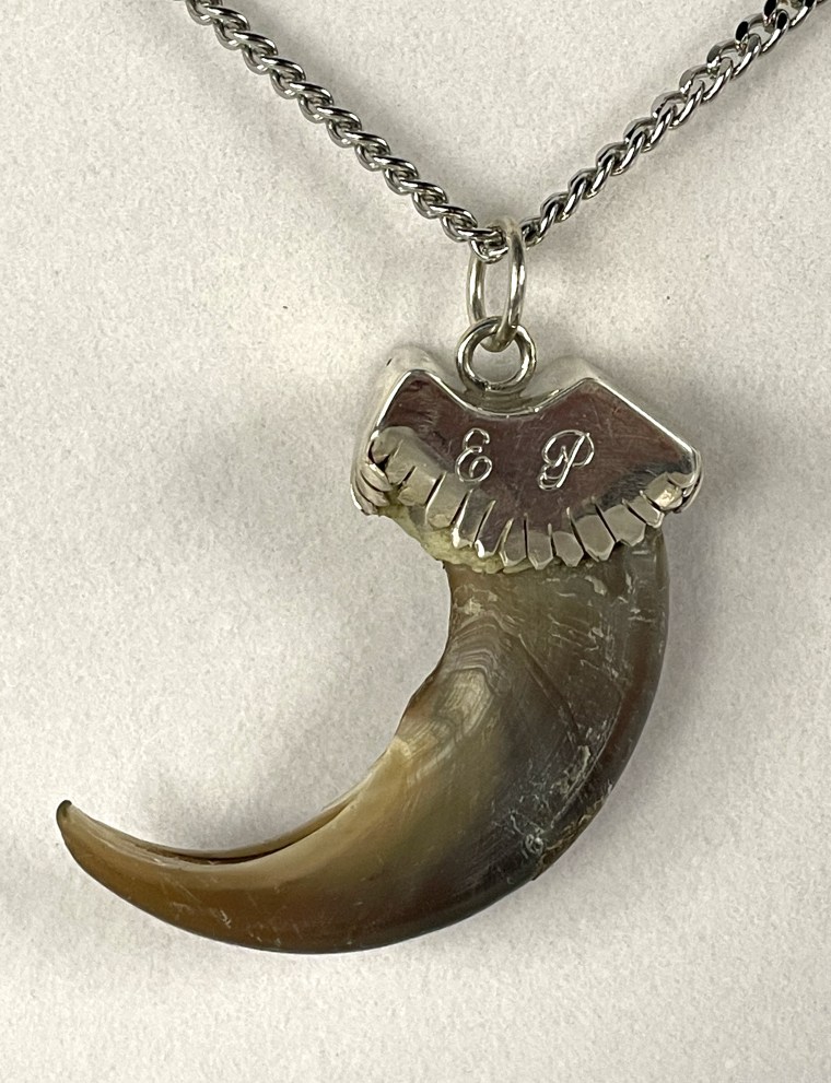 An Elvis Presley owned “E.P.” monogrammed grizzly bear claw necklace estimated to be worth $8,000 to $12,000.