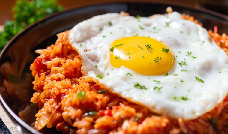 A serving of kimchi fried rice with a fried egg on top.