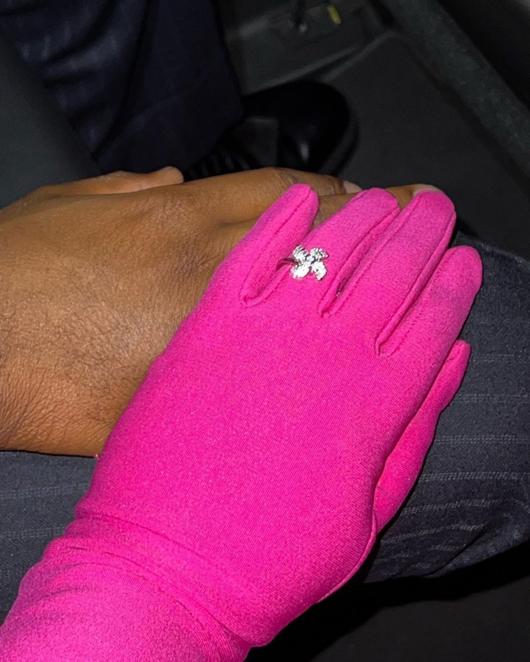 Lizzo shares a photo of her holding what appears to be boyfriend Myke Wright's hand.