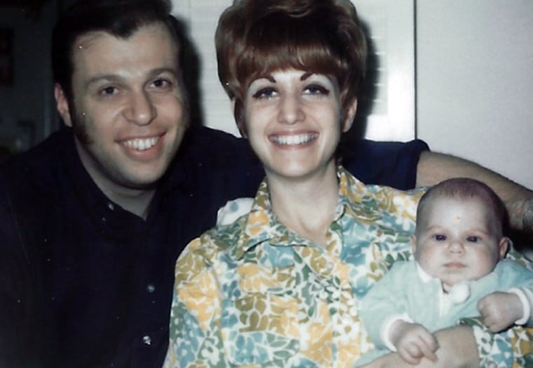 The author at 5 weeks old with her parents, Ron and Lois.