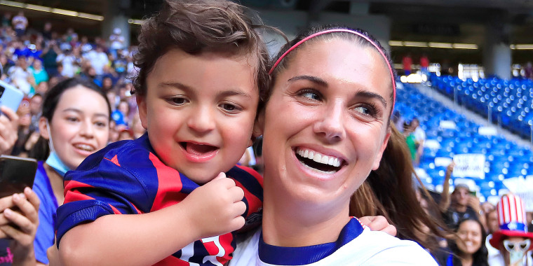 Alex Morgan of the United States celebrates with fan Luca after the match between Jamaica and United States as part of the 2022 CONCACAF W Championship at BBVA Stadium on July 7, 2022, in Monterrey, Mexico.