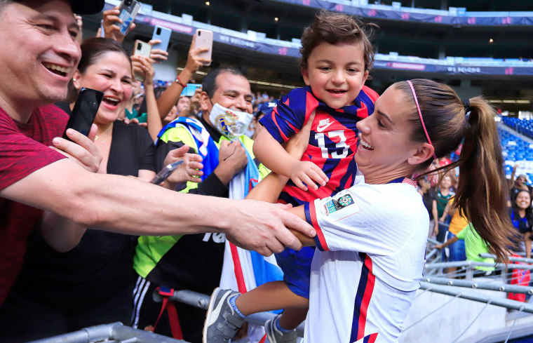 Alex Morgan celebrates with fan Luca.